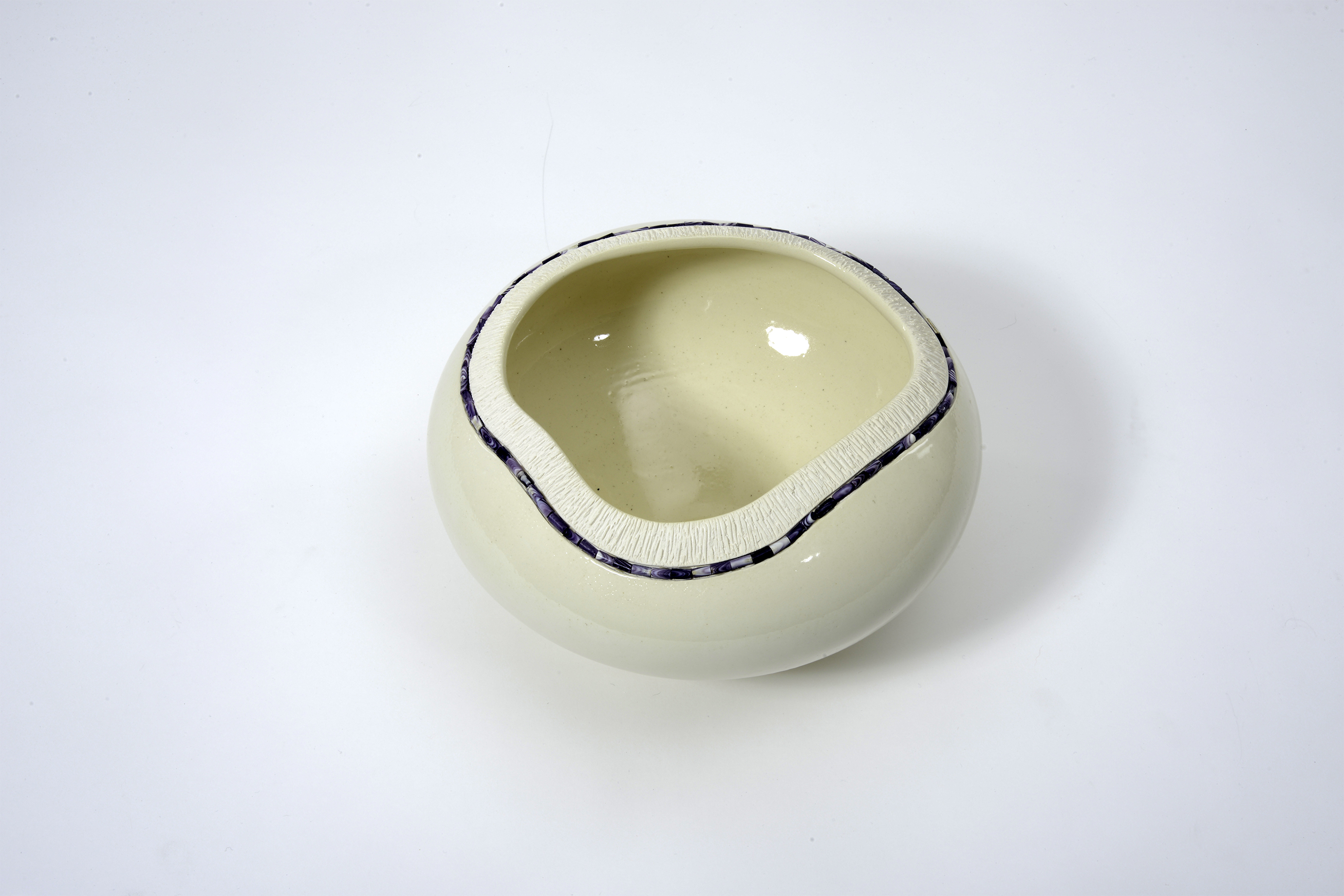 Wampum Pot - "Honor Our Strings" series By Brenda Hill Wampum Pot - "Honor Our Strings" series White porcelain vessel with inlaid purple wampum beads around the lip.